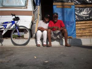 Ridwaan Isaacs with his wife outside their home